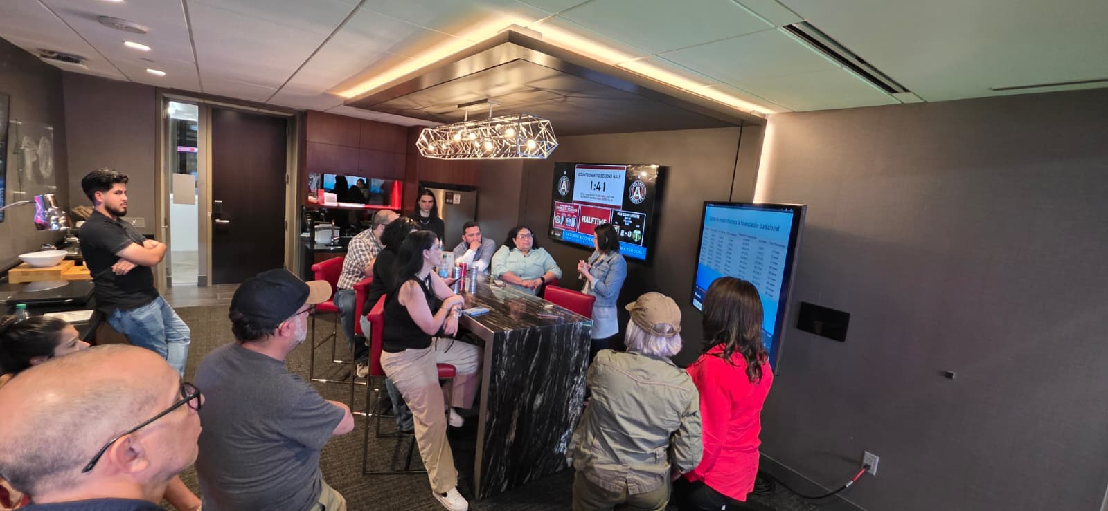 NWX clients watching an Atlanta United match from a stadium suite