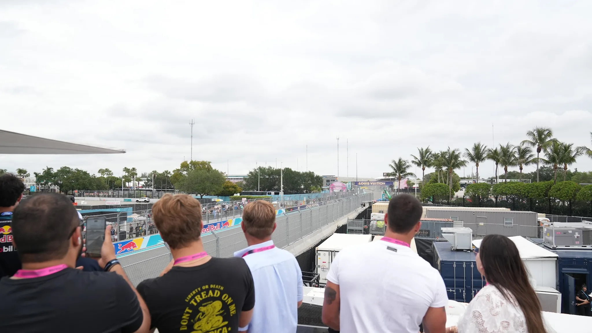 Guests on the GRID House balcony overlooking the Miami circuit