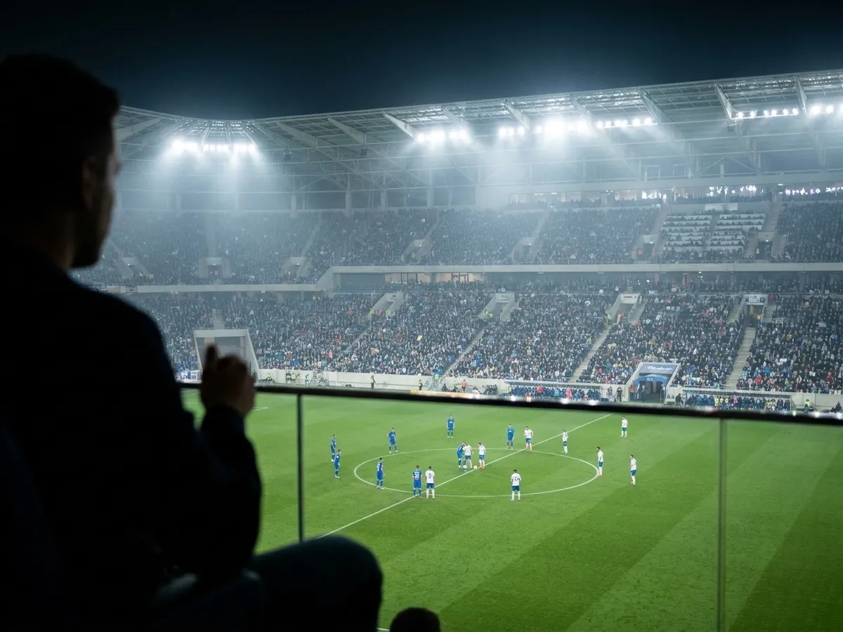 Conceptual image: a soccer match seen from a private suite past a guest's silhouette, generic unbranded kits